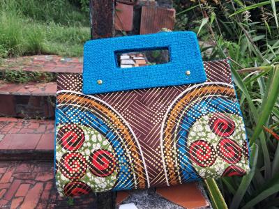 Tata- Turquoise & Brown Hand-Held Clutch: $100.00